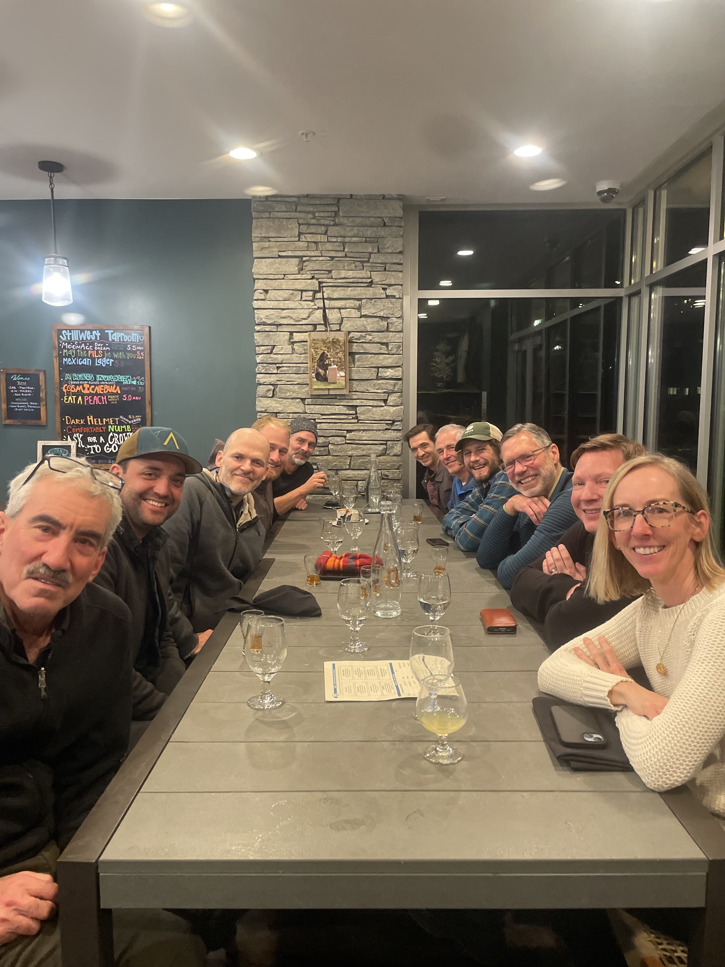 Team photo at rustic cabin